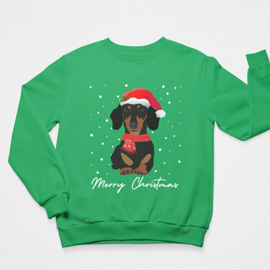 A bright green crewneck sweatshirt featuring a graphic of a dachshund wearing a red Santa hat and scarf, surrounded by white snowflakes, with 'Merry Christmas' written in white script below.