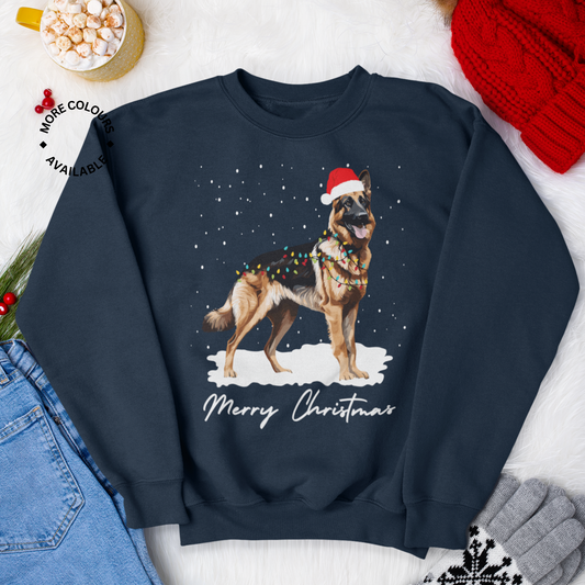 Adults navy coloured sweatshirt with a German Shepherd wearing a Santa hat in the centre, surrounded by a Christmas-themed backdrop with snow and decorations.