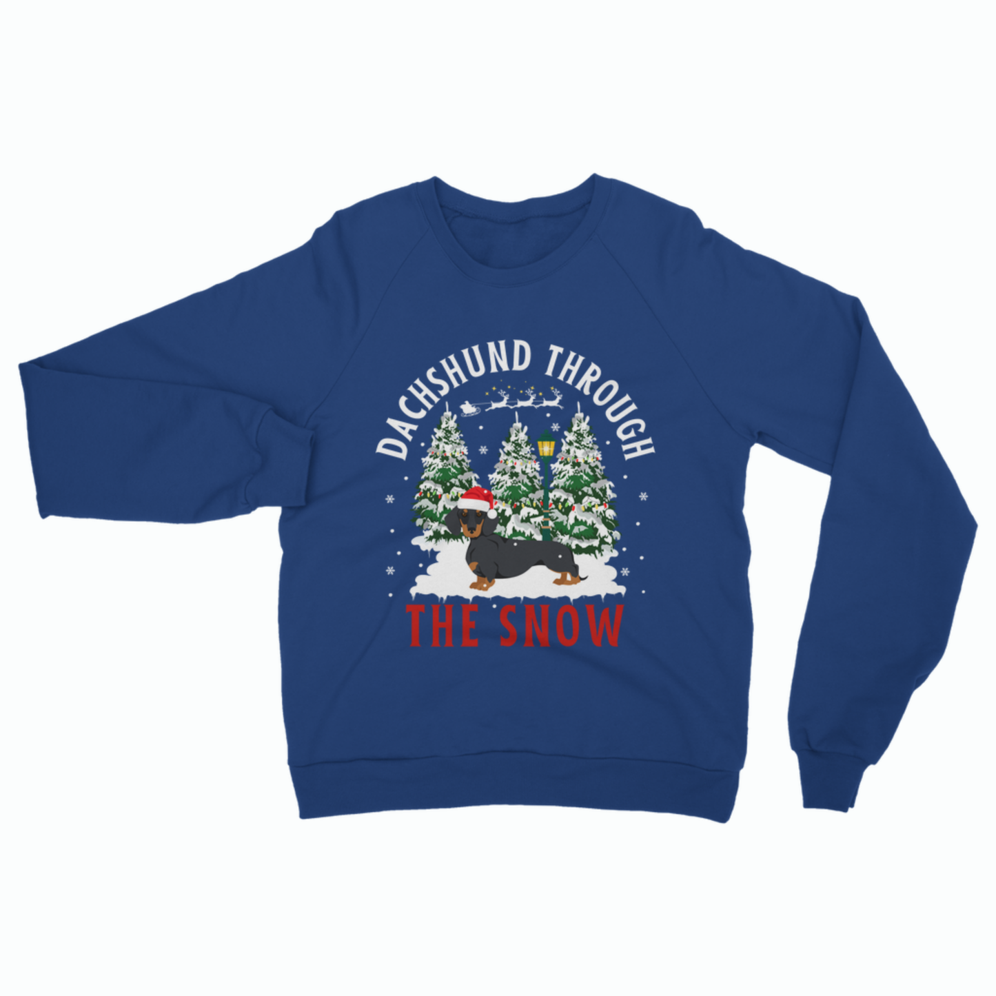 A royal blue crewneck sweatshirt featuring a festive Christmas graphic of a dachshund in the snow with pine trees and the text 'DACHSHUND THROUGH THE SNOW'.