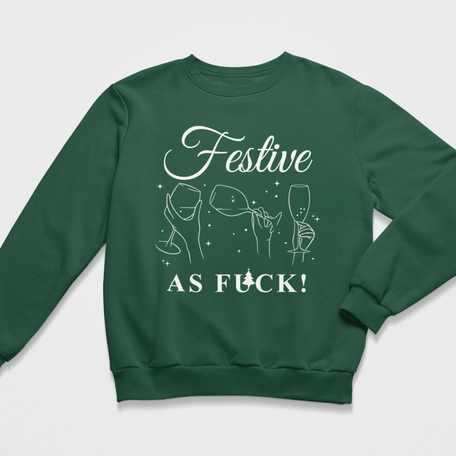Dark green Christmas sweatshirt laid flat, printed with white cursive typography reading Festive As Fuck and line art of clinking wine glasses