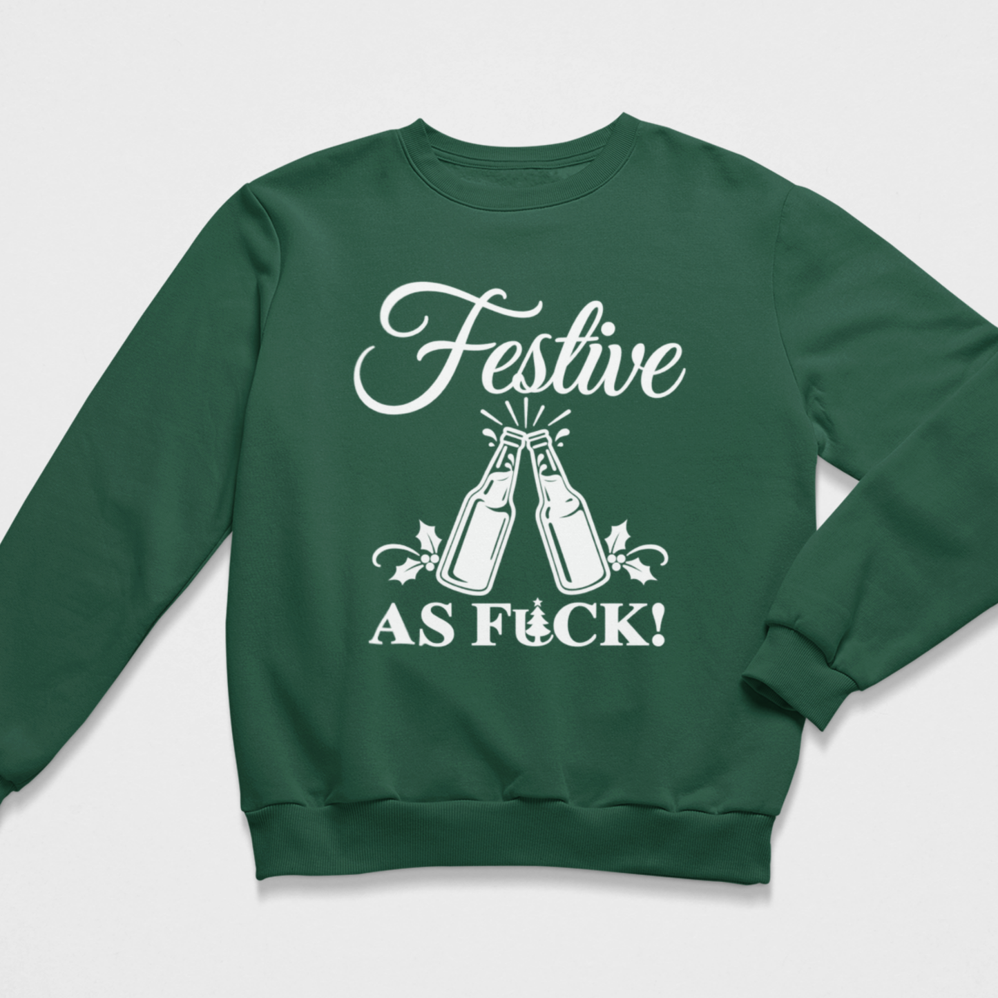 Flat lay of a dark green adult Christmas crewneck sweatshirt featuring a white graphic of two clinking beer bottles surrounded by splash effects, holly sprigs, and the bold text "FESTIVE AS FUCK!" incorporating a tiny Christmas tree in the lettering.
