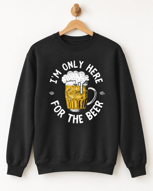 Black adult sweatshirt on a wooden hanger featuring an “I’m Only Here for the Beer” slogan and foaming beer mug graphic.