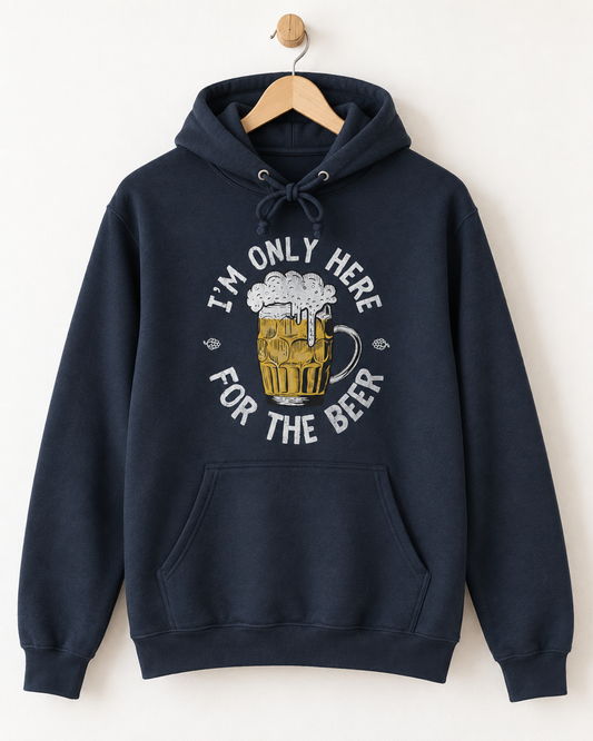 Navy adult hoodie on a wooden hanger featuring the distressed “I’m Only Here for the Beer” slogan and illustrated beer glass.