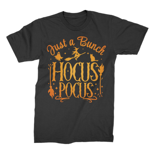 Adults crewneck cotton t-shirt featuring Hocus Pocus Halloween graphic with orange witch, ghost and cat artwork styled on a wooden hanger