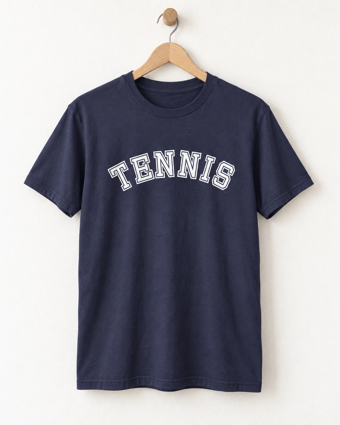 Navy adult T-shirt on a wooden hanger with a white varsity-style Tennis slogan.