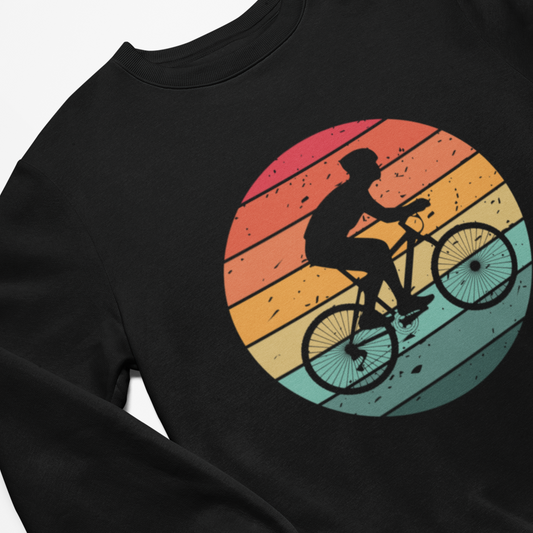 Black sweatshirt with a colorful graphic of a cyclist on a sunset background