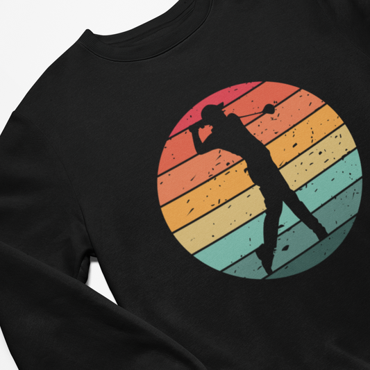 Close up of a men's black sweatshirt with a colourful graphic of a person playing golf 