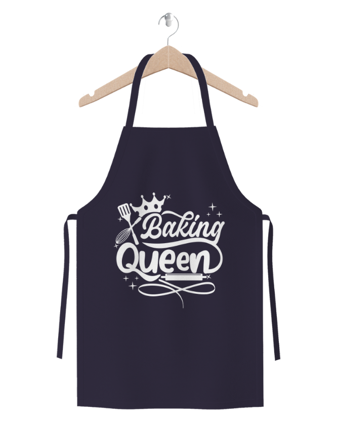 Baking Queen navy blue cotton twill apron with baking crown and whisk design on wooden hanger