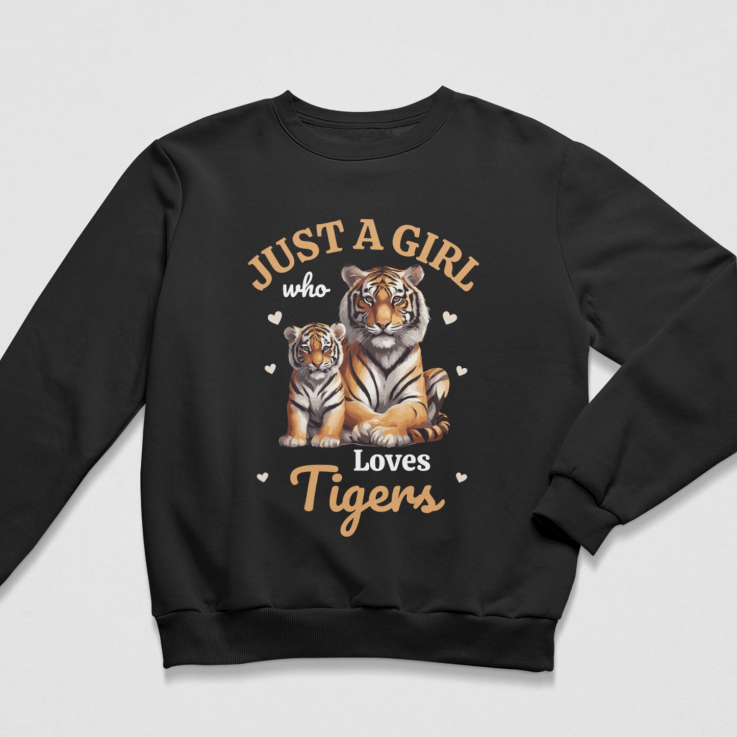 Black kids sweatshirt featuring an adult tiger beside a tiger cub, surrounded by small hearts with bold “Just a Girl Who Loves Tigers” wording.
