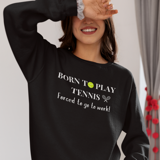 girl wearing black sweatshirt with the printed wording born to play tennis forced to go to work