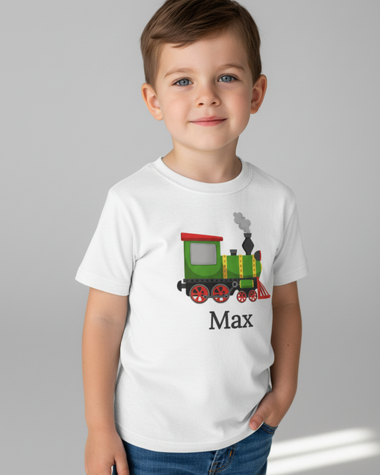 Young boy wearing personalised white steam train t-shirt with name Max, studio portrait, premium cotton kids graphic tee