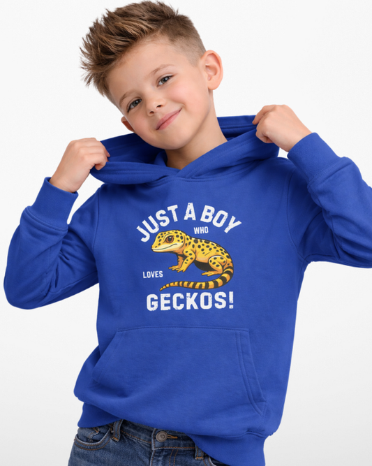 Child wearing royal blue gecko hoodie, holding hood and smiling, “Just A Boy Who Loves Geckos” design clearly visible on front.