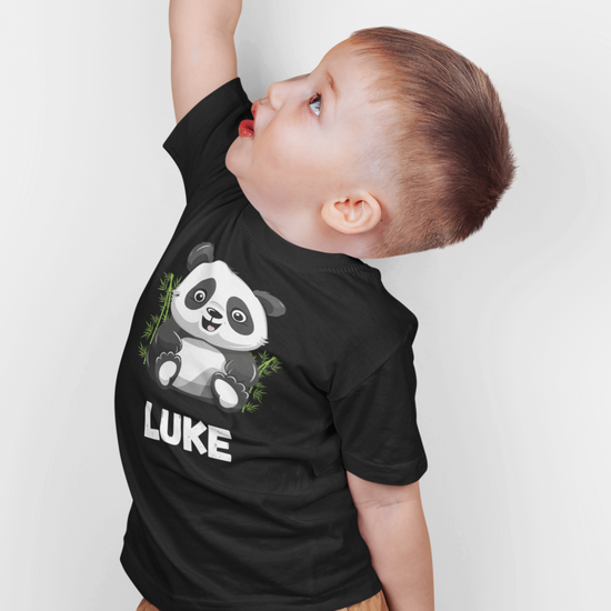 Boy wears black crew neck t-shirt with cute panda design and printed custom name.