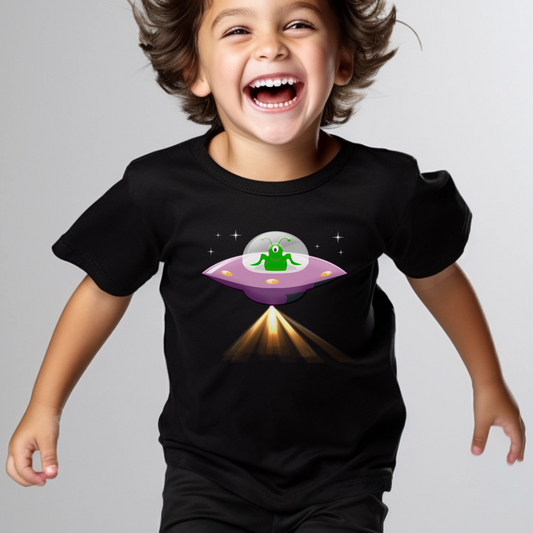 A little boy wearing a black short sleeve t-shirt with a printed alien spaceship 