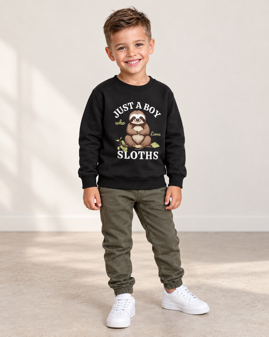 5-year-old boy wearing a black Just a Boy Who Loves Sloths sweatshirt with khaki-green joggers.