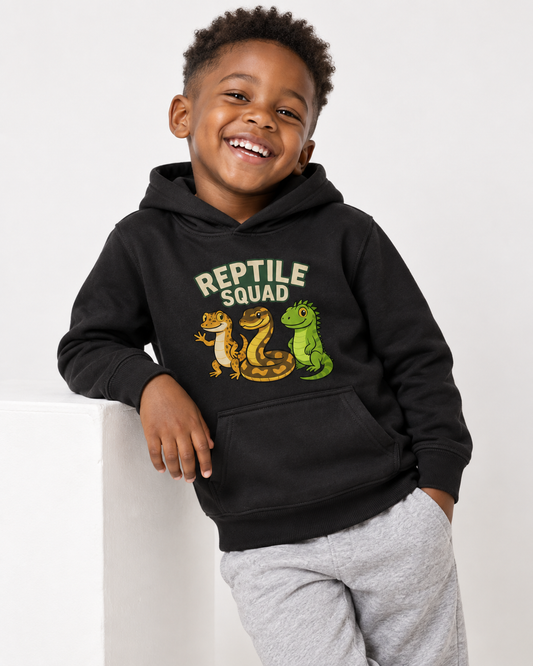 Boy wearing black Reptile Squad kids hoodie with gecko, snake and green lizard print and grey joggers