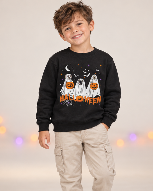Boy wearing a black Halloween sweatshirt featuring three dogs dressed as ghosts with orange pumpkin buckets.