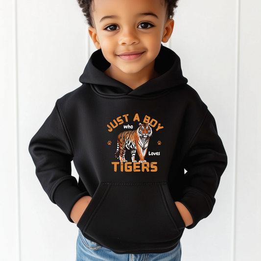 Young boy wearing a black pullover hoodie featuring a bold tiger graphic and the slogan "Just a Boy Who Loves Tigers" – ideal for animal-loving kids aged 3–11