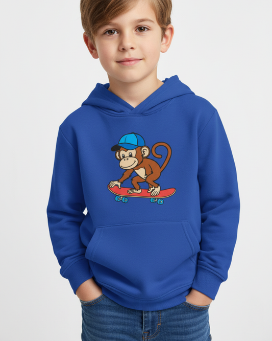 Boy wearing royal blue skateboarding monkey kids hoodie, front view studio portrait showing graphic and fit clearly