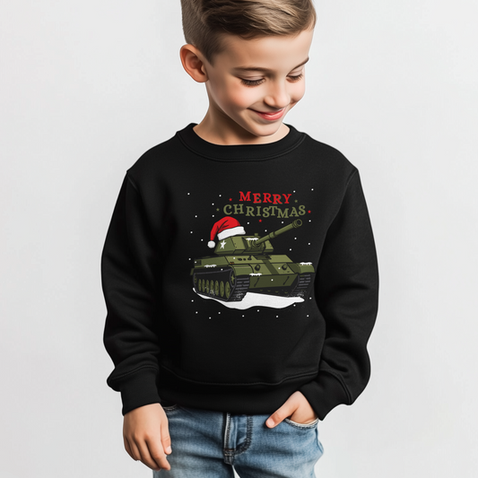 Boy wearing a kids black Christmas jumper featuring a green tank with Santa hat and snow, with red "Merry Christmas" text.