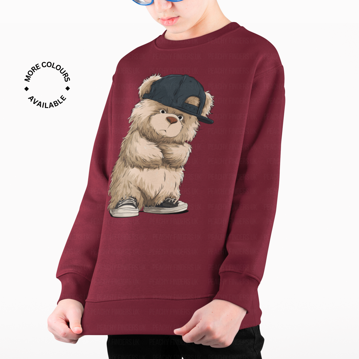 Boy wearing maroon sweatshirt with cool teddy bear graphic