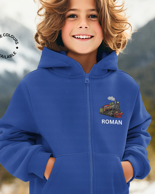 Boy wearing royal blue personalised steam train zip-up hoodie with name printed on left chest