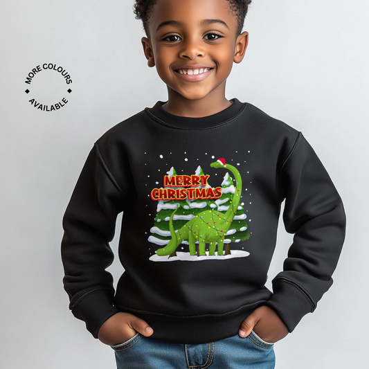 Smiling boy wears kids Christmas sweatshirt with dinosaur tree design