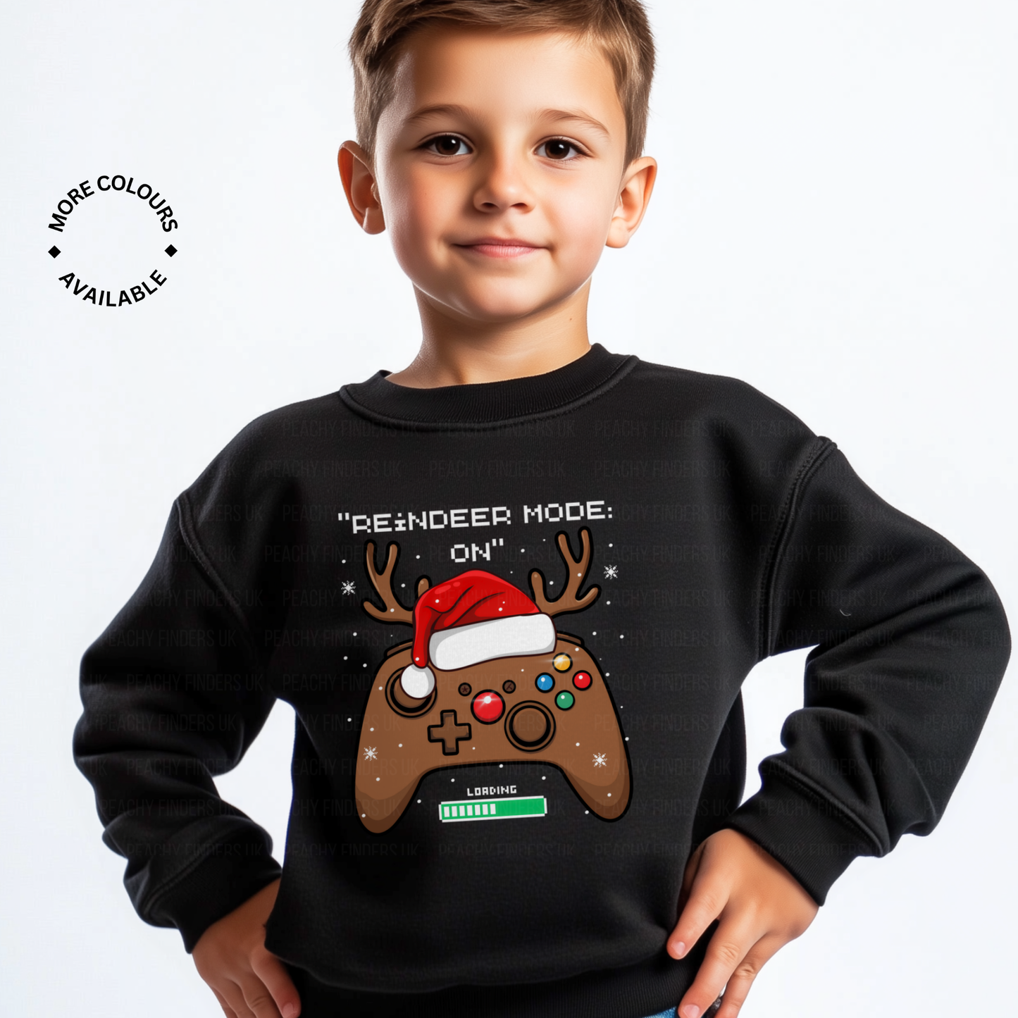 Boy wearing a black Christmas jumper with a reindeer-themed gaming controller design and the slogan “Reindeer Mode: ON”