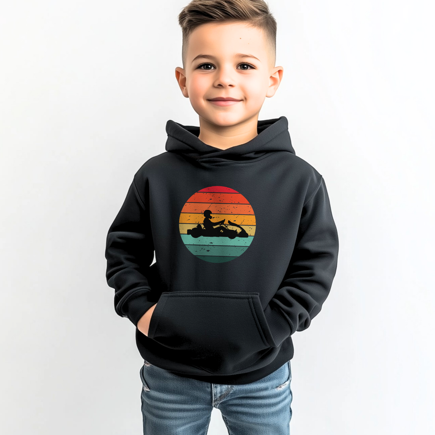 Young boy wearing black hoodie with retro sunset go-karting silhouette graphic