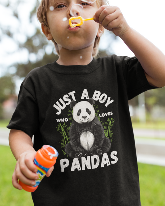 Child blowing bubbles wearing a black t-shirt with a panda design and text.