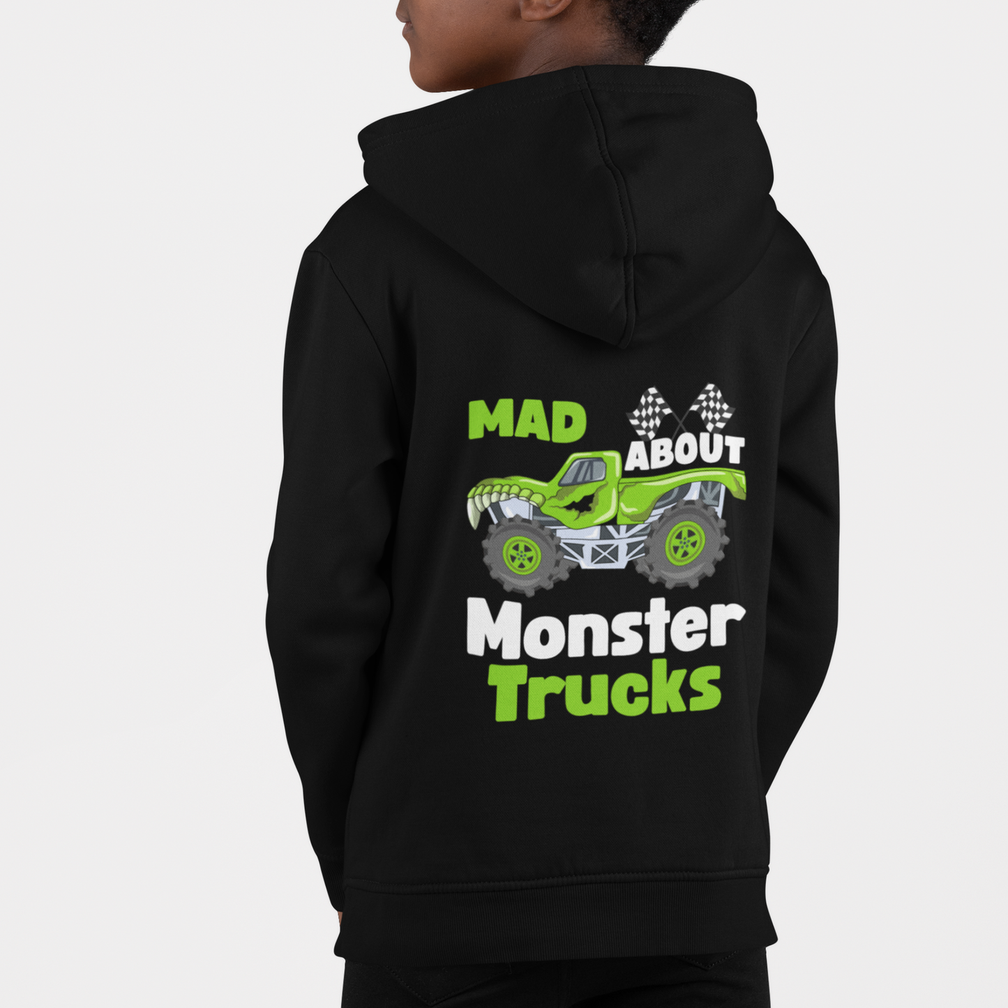 Boy wearing black zip hoodie with green monster truck and “Mad About Monster Trucks” back print.