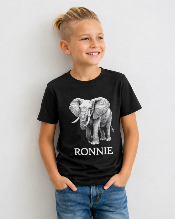 Young boy wearing a black t-shirt with an elephant graphic and custom name 'RONNIE' printed underneath