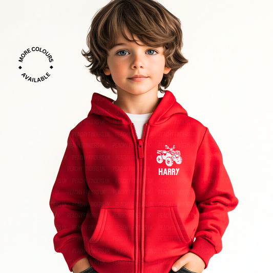 Child wearing a red hoodie with a white quad bike logo and name