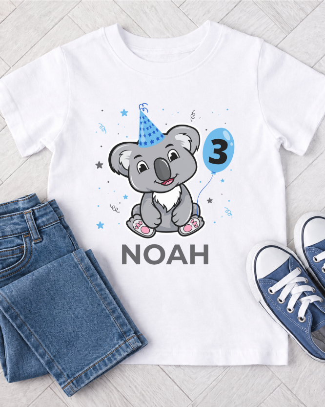 Personalised boys 3rd birthday koala T-shirt flat lay with jeans and blue trainers, name Noah