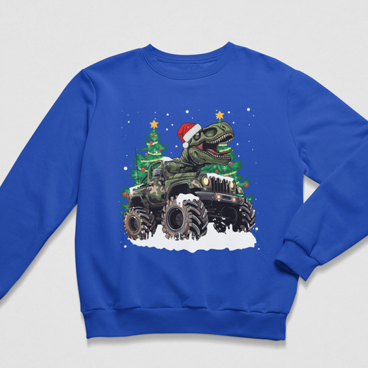 Royal blue boys festive sweatshirt with a roaring dinosaur wearing a Santa hat in a camo monster truck surrounded by snow and Christmas trees.