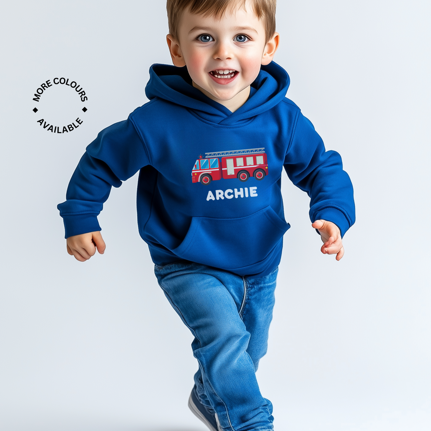 A young boy wearing a blue hooded sweatshirt with a red fire engine design and the name 'ARCHIE' printed on the front.
