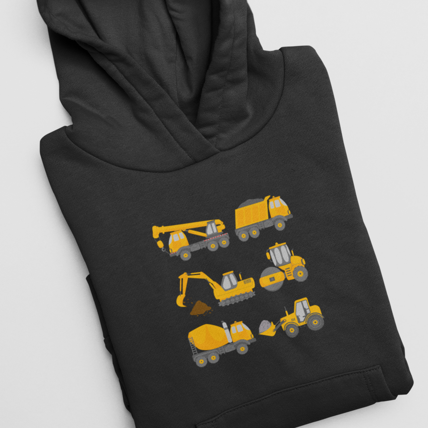 A folded black hooded sweatshirt is displayed, showcasing a graphic with six small, cartoon-style yellow construction vehicles arranged in two rows of three. The vehicles include a crane, dump truck, bulldozer, excavator, cement mixer, and backhoe.