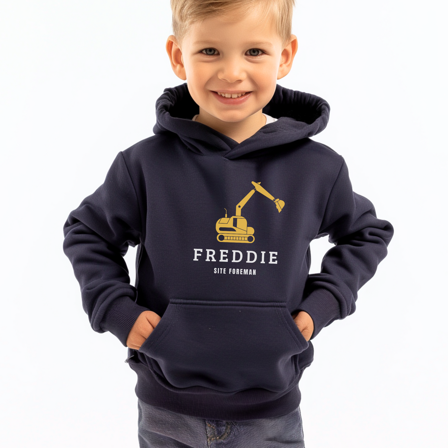A Little boy wearing a navy blue hoddie with a printed digger design, a personalised name and words saying "site foreman" in white 