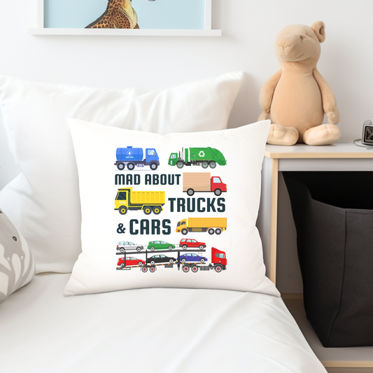 Boys white cushion cover featuring colourful trucks, cars, and transporters with the text “Mad About Trucks & Cars” – ideal for vehicle lovers.