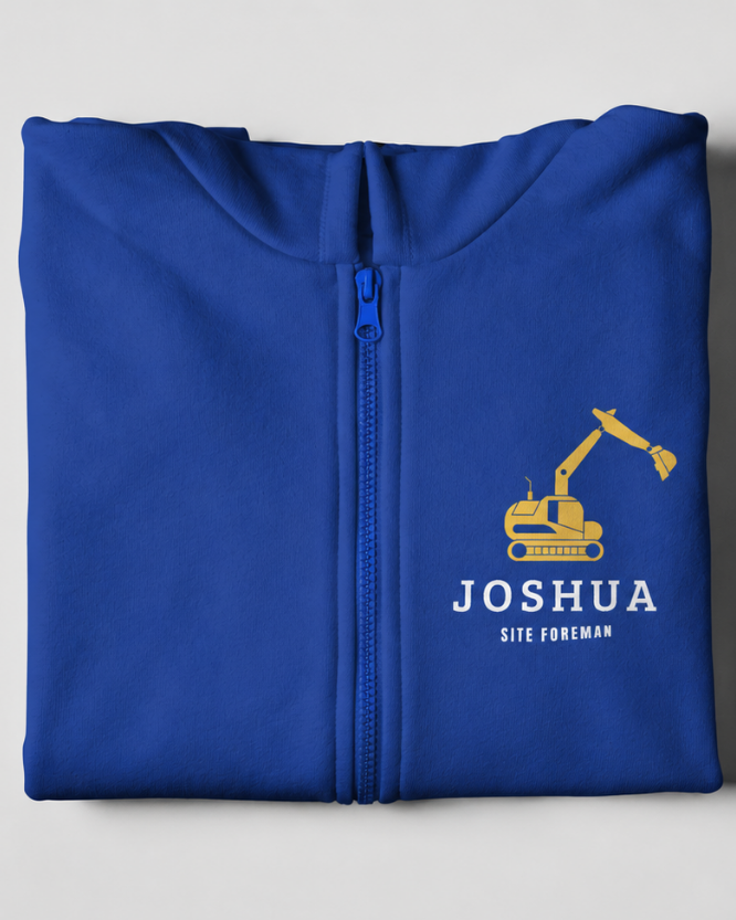 Folded royal blue kids site foreman zip hoodie with yellow digger graphic and personalised name Joshua printed on the chest.