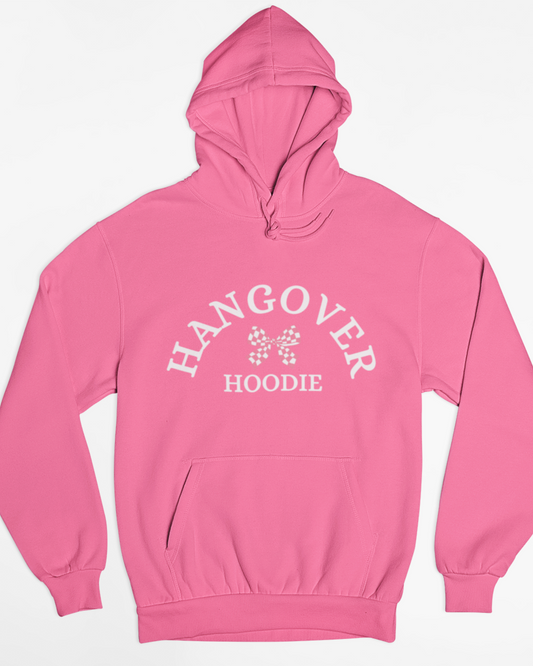 Pink women’s hoodie laid flat on a white background with the text “Hangover Hoodie” and a small bow graphic printed on the front.