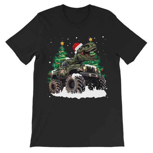 A black cotton t-shirt for kids featuring a graphic of a Christmas-themed T-rex dinosaur in a Santa hat, with a decorated Christmas tree and snow, using digital text and stars.