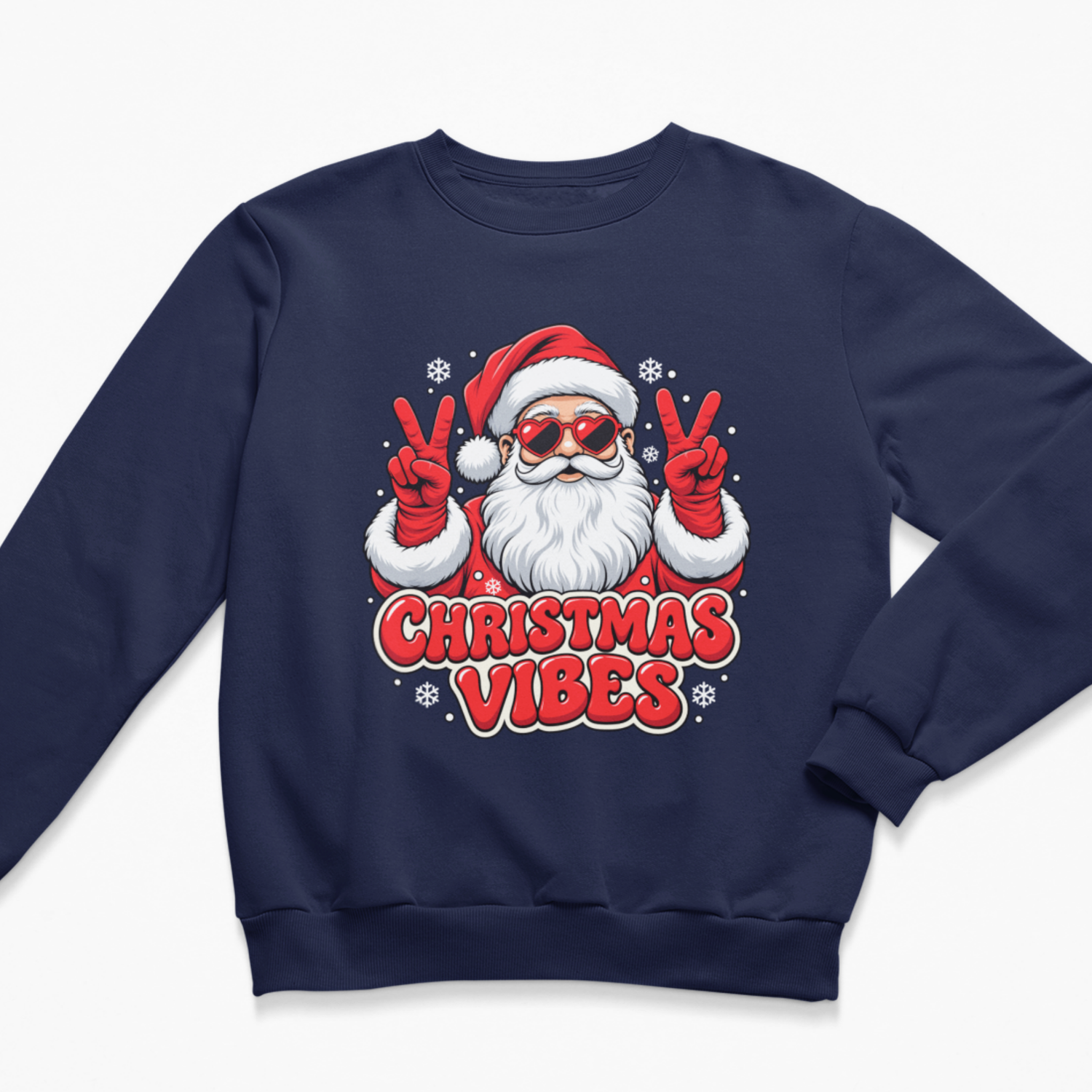 Flat lay of a navy blue Christmas crewneck sweatshirt with a graphic of Santa Claus wearing heart-shaped sunglasses and giving a double peace sign in red mittens, accented with snowflakes and the text "CHRISTMAS VIBES".
