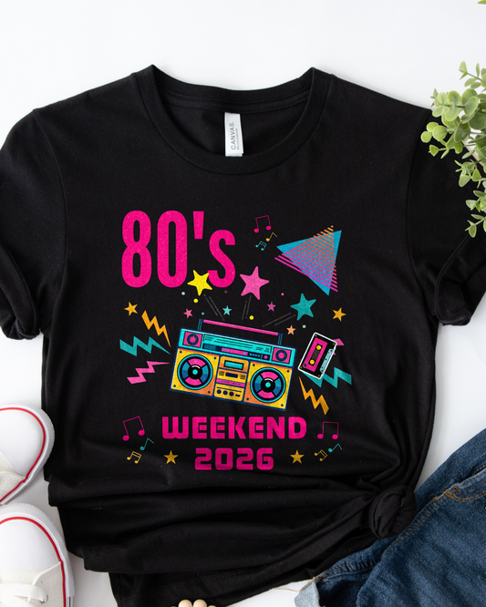 Black t-shirt with '80s Weekend 2026' design on a white background