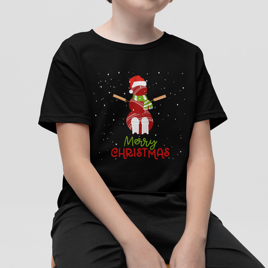 A boy wears a black short-sleeve t-shirt with a cricket ball snowman wearing a Santa hat with falling snow.