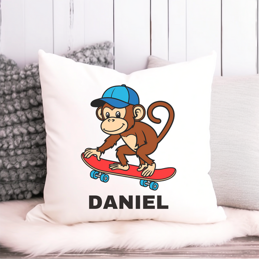 Kids cushion cover with cartoon monkey riding a red skateboard wearing a blue cap, with custom name.