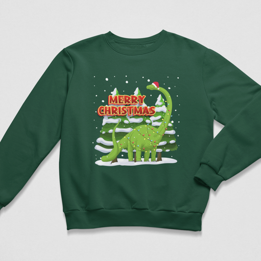 A kids dark green crewneck sweatshirt featuring a festive graphic of a green long-necked dinosaur wearing a Santa hat, standing in front of snowy pine trees with the text 'MERRY CHRISTMAS' in red and white.