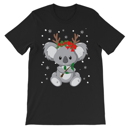 A kids black T-shirt with a printed koala wearing festive antlers and red bows, standing in front of a Christmas tree.