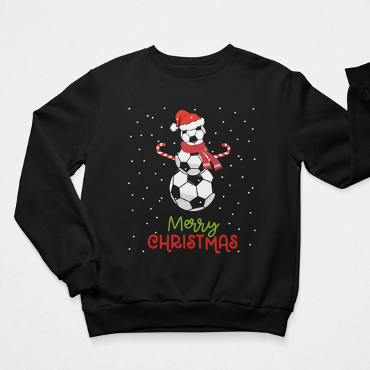 Black crewneck adult Christmas jumper featuring a football snowman in a Santa hat and scarf, candy-cane arms, falling snow and “Merry Christmas” wording.