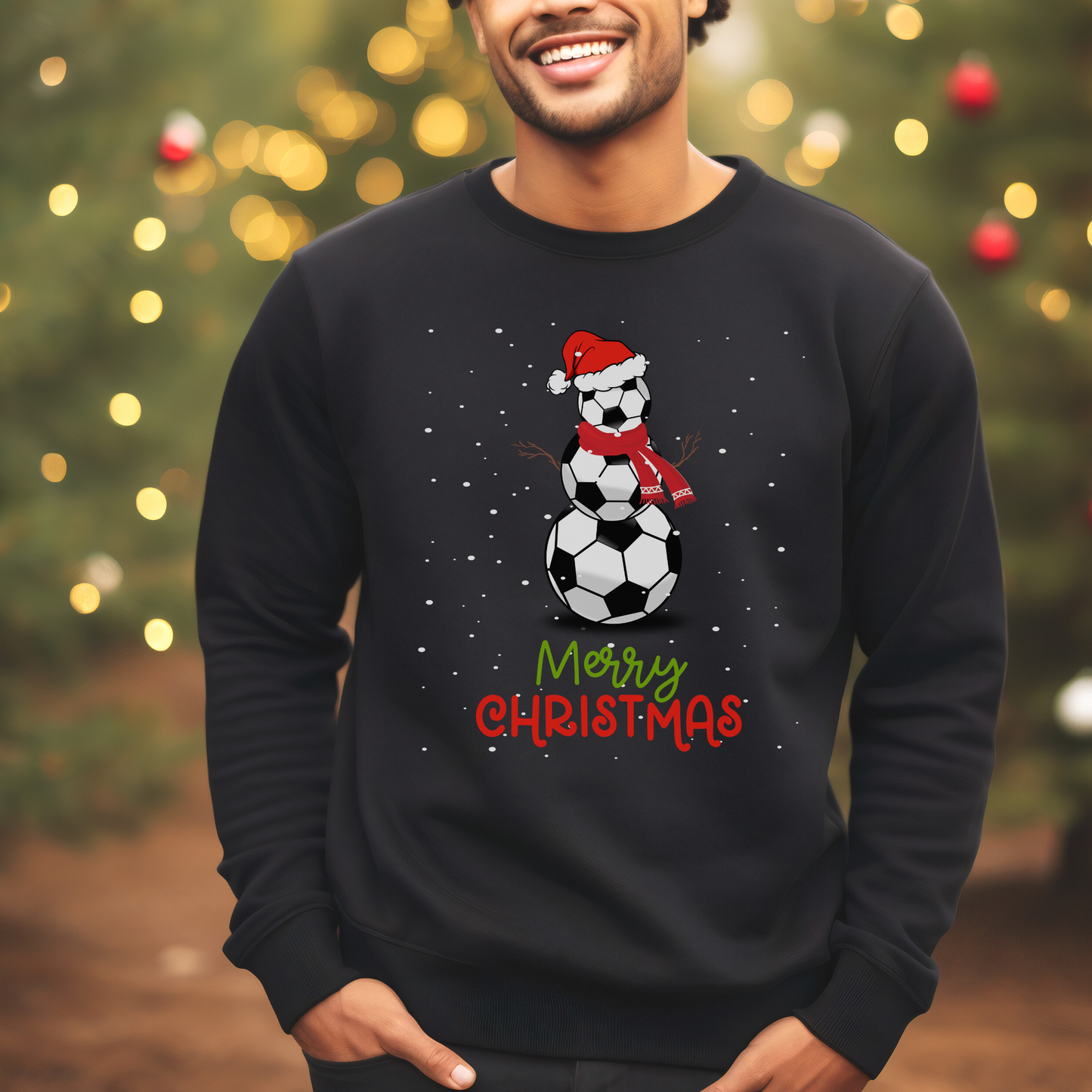 Man wearing a black christmas sweatshirt with a printed design of a football snowman and words saying "merry christmas"